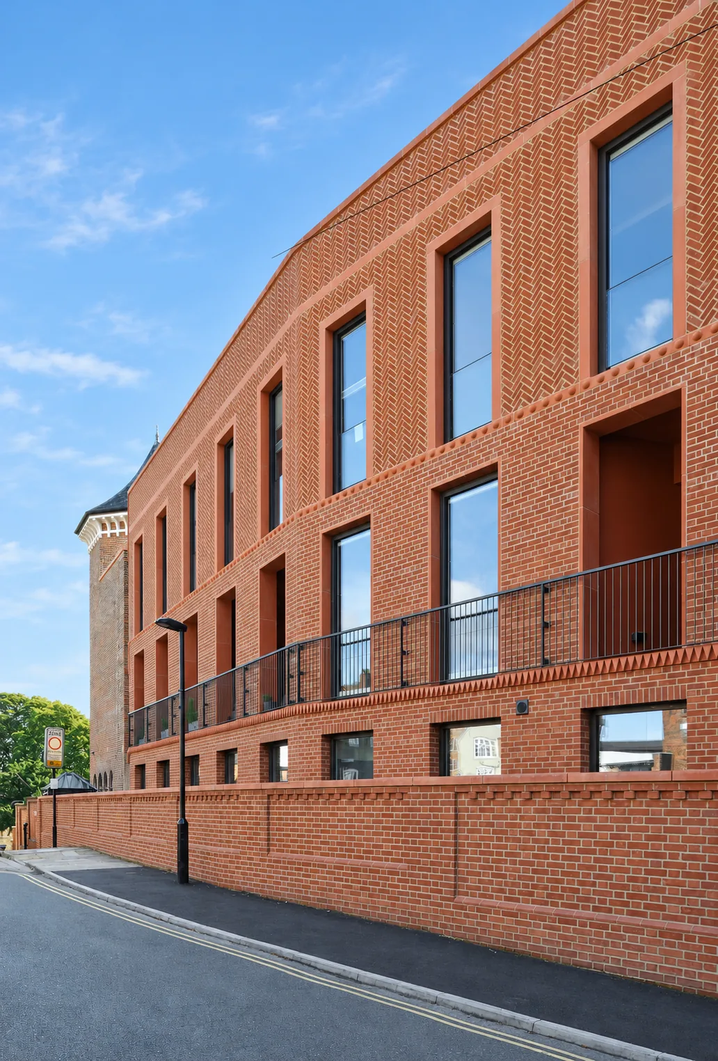 Bailgate Court — herringbone brickwork and deep window reveals on the new terrace